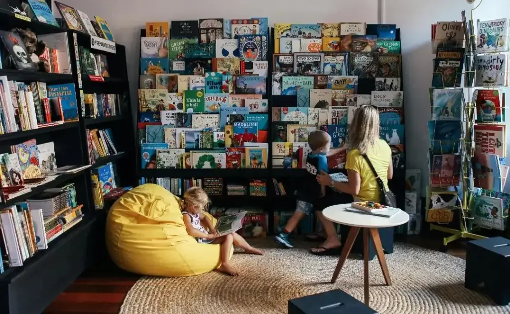 Mother and children building their expat support network at the local library.