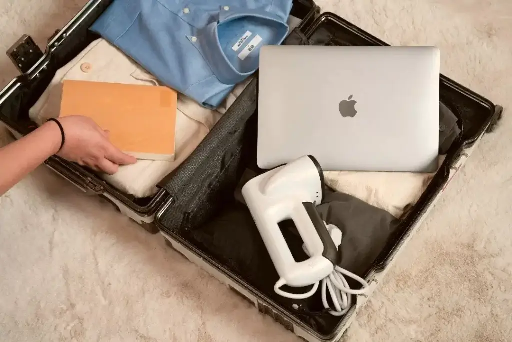 An open suitcase displaying some of the travel kit essentials for families relocating to Germany.