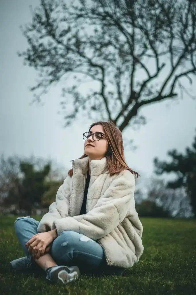 A Mother sitting still to maintain her own emotional balance after carrying the mental and emotional load of the family's international move.