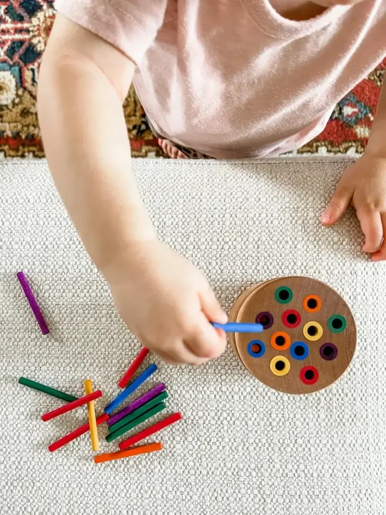 A child playing with her favourite toy. Something that will stay the same after her international relocation.